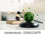 Small photo of world and wooden gavel with a golden scale for law international environmental concept of business corporate and industry. law world for environmental regulation.sustainable environment concept