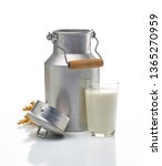 Small photo of milk churn with wheat, eggs and flour on white background