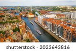 Gdansk, Poland,Europe. Beautiful panoramic aerial photo from drone to old city Gdansk, Motlawa river and Gothic St Mary church, city hall tower, the oldest medieval port crane (Zuraw) and old houses

