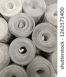 Small photo of rolls of white banking commercial bills piled one onto another