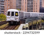 Small photo of A Manhattan bound Q train curving away from West Eighth Street- NY Aquarium consisting of R46 subway cars