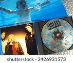 Small photo of HAMBURG, GERMANY, January 22 - 2024: Nevermind Album Nirvana CD - Grunge Music Kurt Cobain and Band