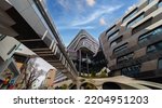 Small photo of Residential and commerical high rise apartment building in inner Melbourne suburb VIC Australia. Residential and commercial building complex in leafy suburbia. Urban living high density suburban city