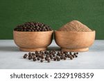 Ground black pepper with grains of black pepper
