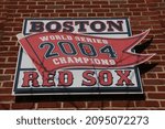 Small photo of Boston, Massachusetts, USA - November 30, 2021: Commemorative sign for the 2004 World Series champion Red Sox team outside Fenway Park