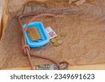 Small photo of Symbolic scene, solid soap, a gallows loop, euro coins, 10 euro banknote. Hopelessness due to lack of earning opportunities, dismissal of employees, replacement of workers with artificial intelligence