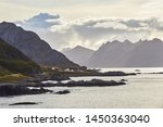 The road from Nyksund Vesterålen along the fjord with several layers of mountains 