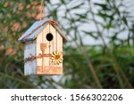 A Bird House Decorated In A...