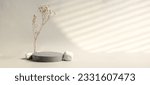 Small photo of Minimal stone stage product display with sunlight from window and dry flower on cream color background