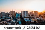Small photo of Dar es Salaam - Tanzania - June 15 2022 - Cityscape of Dar es Salaam at sunset featuring residential and office buildings.