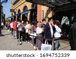 Small photo of SuzhouChina-April 2020: life returns to normal after coronavirus in China. Crowd of people wearing protective mask, waiting outside NIKE store for shopping. Retaliatory consumption concept