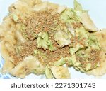 Small photo of Mashed banana and avocado with raw amorphous pollen. Healthy food