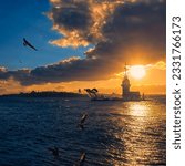 Small photo of Awesome sunset at Maiden Tower. An iconic landmark on Istanbul's skyline, the Maiden's Tower has a rich history dating back to the fourth century, as well as a few legends.