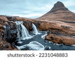 Kirkjufell mountain with waterfall in the foreground during winter