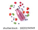 Fresh wild berry juice in glass bottle