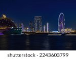 Small photo of 30th Dec 2022 - Dubai, UAE: Night view of Dubai skylines in the JBR area, including Dubai eye, Address beach resort, and Costa Toseana cruise hotel.