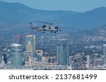 San Diego, California - March 11, 2022: US Navy Sikorsky MH-60R Seahawk helicopter in flight over North Island with San Diego in the background, Photographed from Carrillo National Monument.