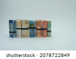 Roll 10 banknotes from a few country. currency money. Banknotes stacked on each other in different positions.  Concept Currency exchange, investment, business, economy and finance.