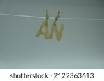Small photo of Word 'AN' on white background. "An" is indefinite articles that precede nouns or the adjectives modifying nouns. Concept for art and education.