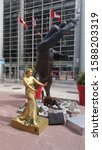 Small photo of Ottawa Ontario Canada August 7 2017. Territorial Prerogative Polar Bear monument and street performer. Monument created by late sculptor Bruce Garner.