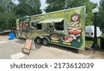 Small photo of Ottawa Ontario Canada June 30 2022. Ozzy's food on wheels food trailer at the Ottawa Jazz Festival in Confederation Park.