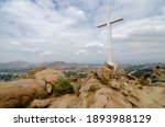 A beautiful shot of the cross on a rocky mountain of Mount Rubidoux in California