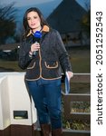 Small photo of JOHANNESBURG, SOUTH AFRICA - Aug 11, 2021: A vertical shot of behind the scenes of celebrity news anchor and tv host Leanne Manas on location
