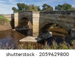 A Stone Arched Bridge Over The...