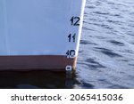 Small photo of A closeup shot of a ship bow showing the plimsoll depth gauge