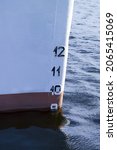 Small photo of A vertical shot of a ship bow showing the plimsoll depth gauge