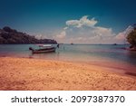 Small photo of A beautiful shot of a bunch of boats in a sea at Ao Yon Beach, Phuket