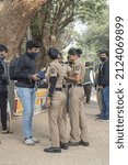 Small photo of MUMBAI, INDIA - Jan 28, 2022: A view of three policewomen talking to a photographer