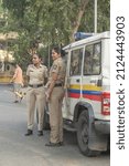 Small photo of MUMBAI, INDIA - Jan 28, 2022: A view of two policewomen standing near the police vehicle at Shivaji Park mumbai Maharashtra