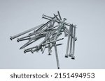 A closeup shot of construction screws isolated on gray background