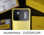 Small photo of MARIBOR, SLOVENIA - Mar 17, 2022: A selective focus shot of the vibrant yellow Xiaomi Poco M4 Pro smartphone