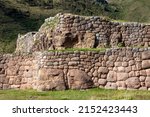 Small photo of A beautiful view of the Puka Pukara Inca Archaeological Complex with its stone walls in Cusco, Peru