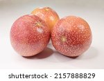 Small photo of Passiflora edulis, commonly known as passionfruit, is a vine species cultivated commercially for its sweet, seedy fruit