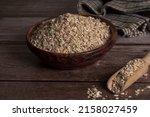 Oat Flakes In A Wooden Bowl...