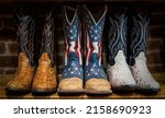 Small photo of A closeup of Cowboy boots decorated with the American flag on sale in shops in downtown Nashville, Tennessee