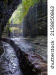 Small photo of A vertical shot of the Rainbow Falls at Watkins Glen State Park, Finger Lakes, upstate New York, USA