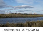 Small photo of HARTLEPOOL, UNITED KINGDOM - Sep 11, 2021: A view across Greatham Creek towards the heavy industry of Teesside, UK