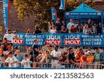 Small photo of SI, ROMANIA - Jul 26, 2022: A number of people and fans watching the Red Bull Romanaics prologue street races in Sibiu