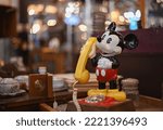 Small photo of KANSAS CITY, UNITED STATES - Jan 14, 2022: A shallow focus of Mickey Mouse vintage rotary classic phone
