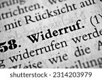 Small photo of A closeup of the german word Widerruf written in bold font surrounded by blurred words Translation- revocation