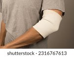 Small photo of Man wearing an elastic Ace Bandage