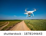 drone quadcopter on green corn field