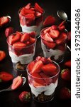 Small photo of Strawberry desserts in cups. Summer snack strawberry yogurt granola.