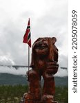 Small photo of Hajjell, Norway - August 19 2017: a troll, a fairy-tale character from Norwegian legends; traditional norwegian troll figurine carved from wood, holding the norwegian flag
