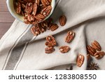 Bowl With Pecan Nuts On Table