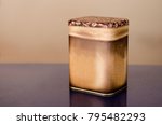 Aluminum Tin Can painted with coffee granules on brown background Canned packaging for coffee or tea, gift box.